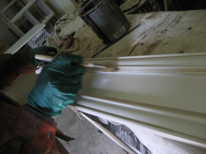 glaze being applied by hand to painted door