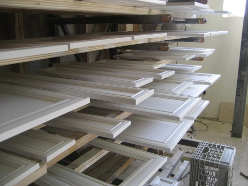 painted door and drawer fronts waiting for hand-brushed glaze